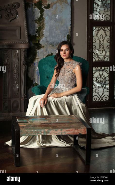 Glamorous Brunette Woman Posing In Dark Vintage Interior Stock Photo Alamy