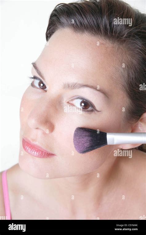 Female Brunette Hair Off Face Wearing Pale Pink Eyeshadow And Liquid Eyeliner Pink Lipstick