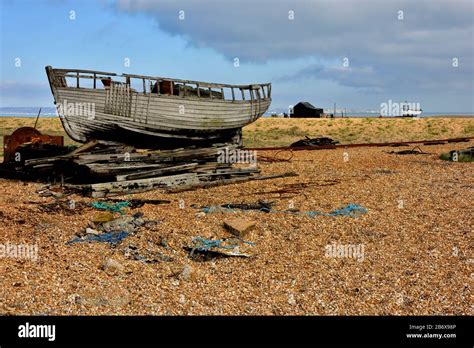 One Of The Many Rotting Derelict Fishing Boats On The Shingle At