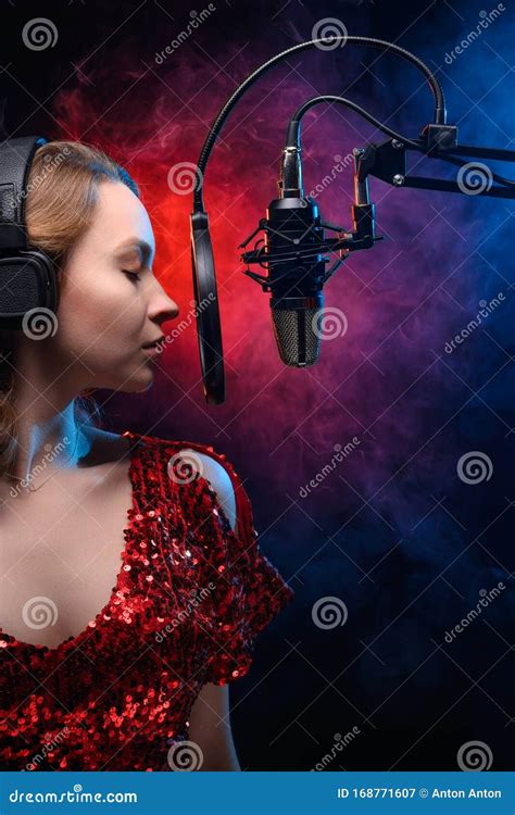 Karaoke A Female Vocalist Sings Into A Microphone Vocal And Study Of