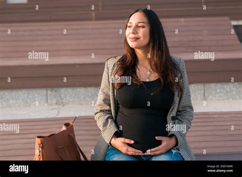 Urban Portrait Of A Modern Pregnant Latina Woman Pregnancy And