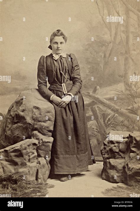 Vintage 1800's portrait photo of a young girl dressed in period style ...
