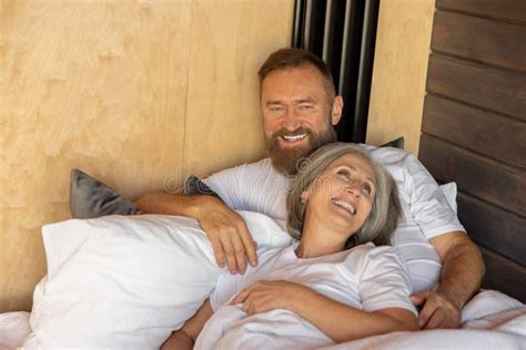 Mature Couple Staying In Bed And Looking Happy Stock Image Image Of