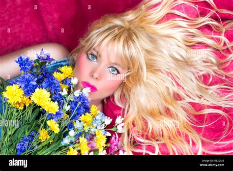 Blonde Woman With Blue Eyes And Flowers Stock Photo Alamy