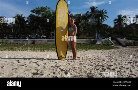 Sexy Surfer Girl Wearing Bikini Posing With Surfboard On Tropical Beach Stock Video Footage Alamy