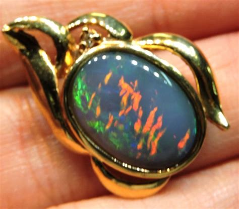 EXCITING RED AND GREEN FIRE BLACK OPAL PENDANT 18K WITH GENUINE DIAMOND