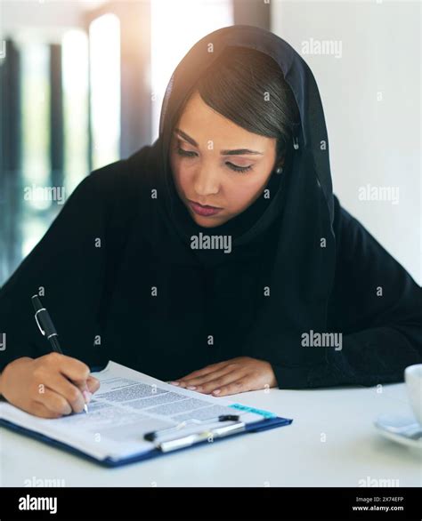 business documents  muslim woman writing contract  planning