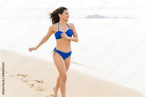 Sexy Woman In Bikini Running On Beach Stock Photo Adobe Stock