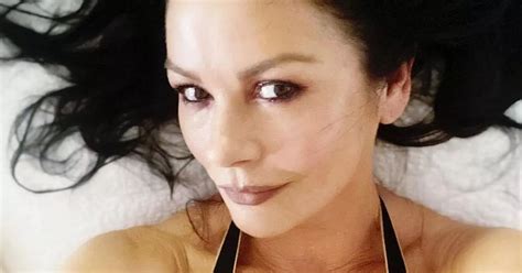 Catherine Zeta Jones Wows As She Shows Off Age Defying Figure In Tiny Black Bikini Daily Star