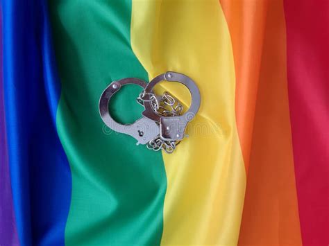 Handcuffs And Gay Flag Arrest Gays And Lesbians Stock Photo Image Of Lgbt Flag 264770346