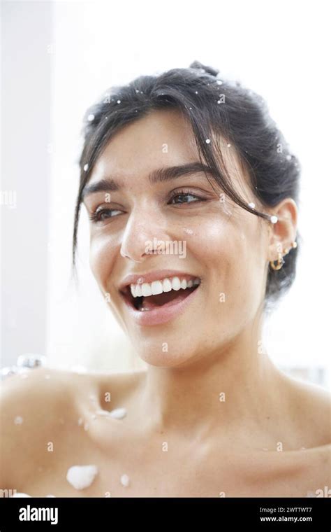 Woman Smiling With Water Droplets On Skin Stock Photo Alamy