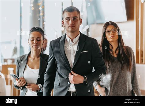 Group of successful business people standing together at office Stock ...