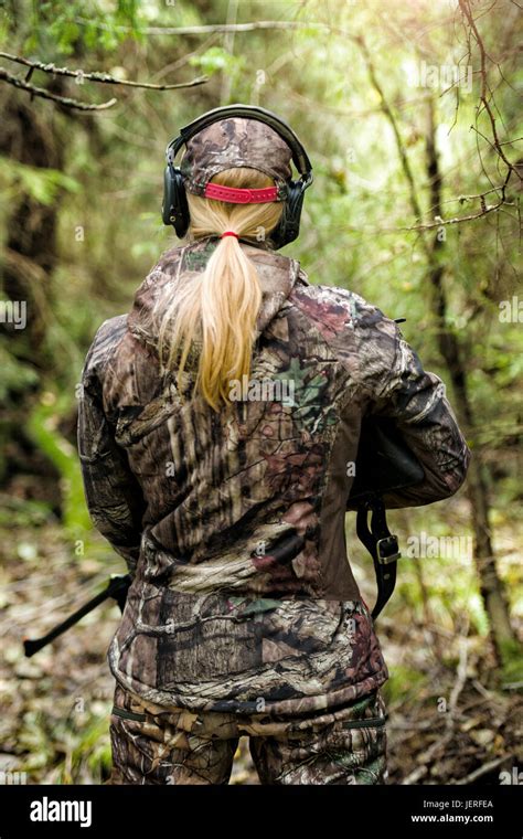 Woman Hunting In Forest Stock Photo Alamy