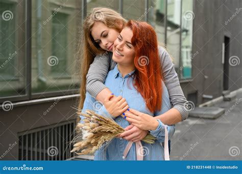 Same Sex Relationships Happy Lesbian Couple With Dried Flowers Stock Photo Image Of Fiance