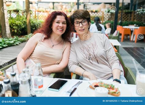 Happy Mature Mother And Her Adult Daughter Enjoying In Conversation While Spending Mother X S