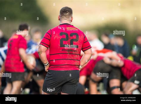Male Amateur Rugby Union Football Players Playing A Game Of Rugby With Their Numbered Shirts