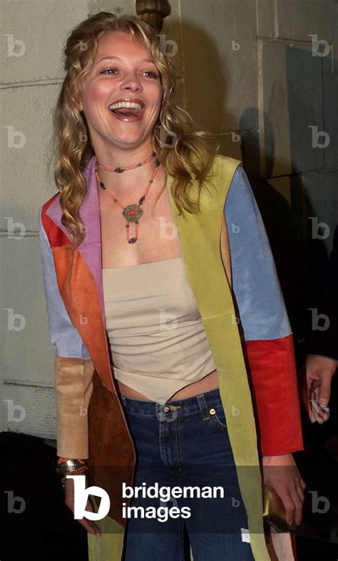 Image of Actress Amanda Detmer poses for photographers at the premiere of