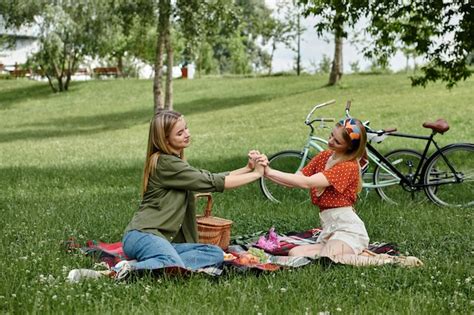 Premium Photo A Lesbian Couple Picnic Romance In A Lush Park