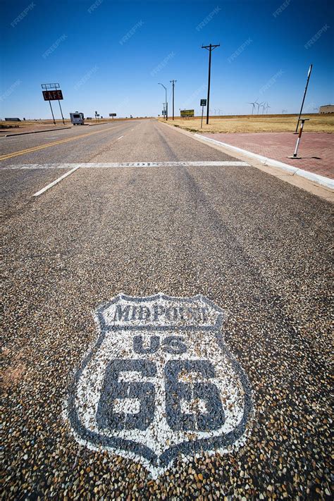 Premium Photo | Midpoint symbol on road for iconic route 66