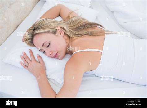 Relaxed Blonde Woman Sleeping In Bed Stock Photo Alamy
