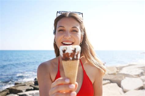 Premium Photo Closeup Of Beautiful Bikini Woman Holding Ice Cream Cone Italian Gelato Looking
