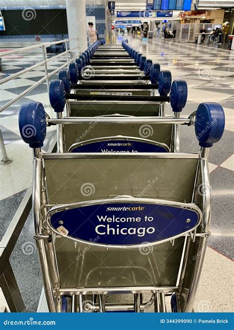 A Line of Luggage Carts Stand Ready for Use at O Hare International
