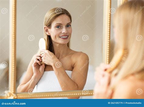 Haircare Concept Happy Mature Woman Brushing Her Hair With Comb While