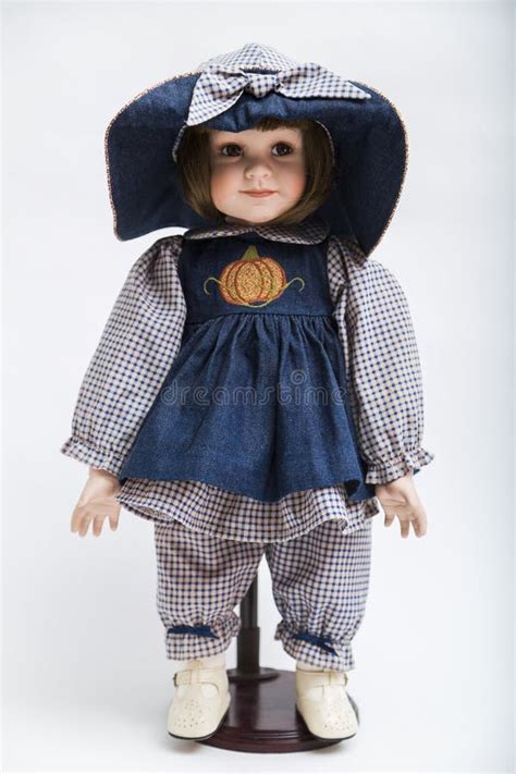 Ceramic Porcelain Handmade Brunette Doll In Big Hat And Blue Dress Stock Photo Image Of Plaid