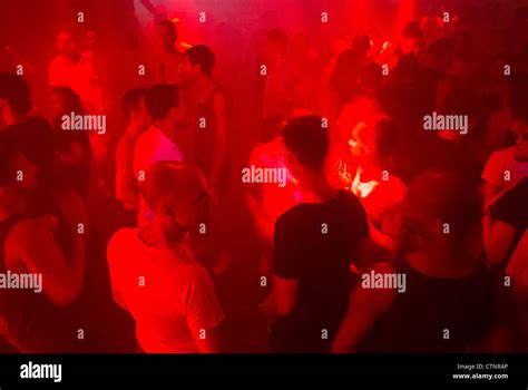 Paris France Crowd Gay Men Dancing On Dance Floor In Nightclub Light Effects Haze Stock