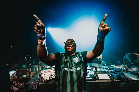 Demi Sims Puts On A VERY Busty Display In A Black PVC Bikini Top As She Cosies Up To On Off