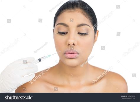 Calm Nude Brunette Holding Injection Looking Stock Photo