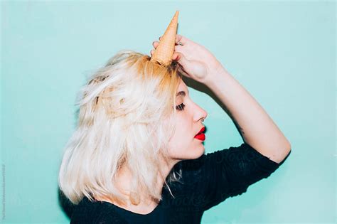 Woman With An Ice Cream Cone On Her Head By Stocksy Contributor