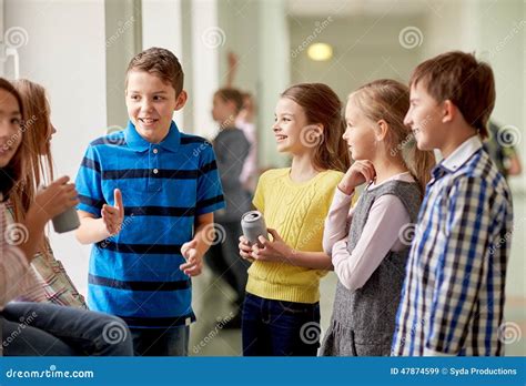 Group Of School Kids With Soda Cans In Corridor Stock Image Image Of