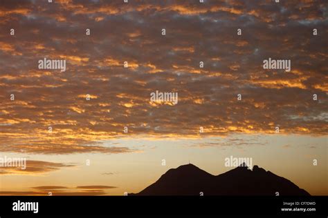 Cerro de la Silla (Horse Saddle Mountain) during golden sunrise in Monterrey, Mexico Stock Photo ...