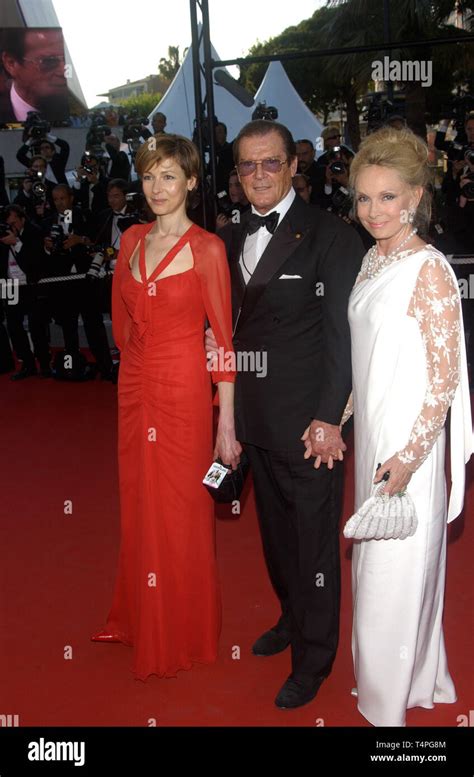 CANNES, FRANCE. May 18, 2004: Actor SIR ROGER MOORE & daughter actress DEBORAH MOORE & wife KIKI ...