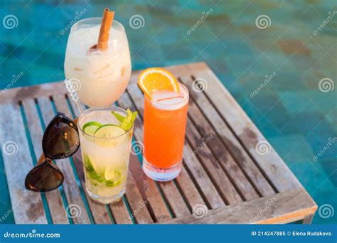 Three Perfect Cocktails Pina Colada Sex On The Beach And Mojito Pool Background Stock Image
