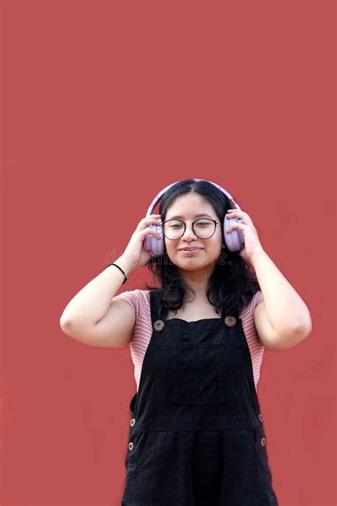 Year Old Latina Teenage Woman Uses Her Headphones To Listen To Music In Her Depression