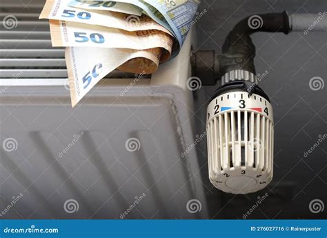 Radiator Control And Euro Bills On The Central Heating Stock Photo