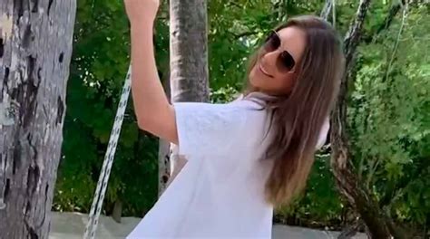 Video Liz Hurley Takes A Risk On Fragile Swing Wearing A Tiny White Bikini