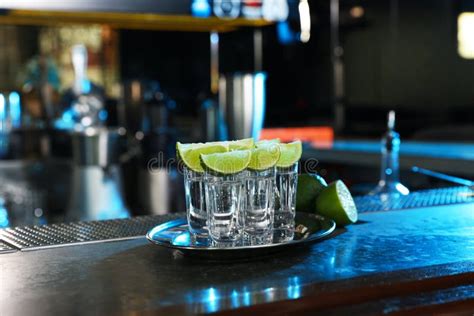 Mexican Tequila Shots With Lime Slices On Counter Stock Photo Image