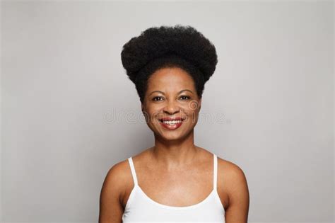 Happy Mature Woman Smiling And Looking At Camera Studio Portrait Stock Photo Image Of Care