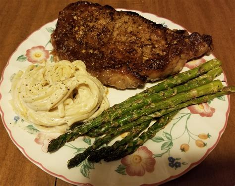 Homemade Garlic Butter Basted Ribeye Alfredo Linguine And Lemon