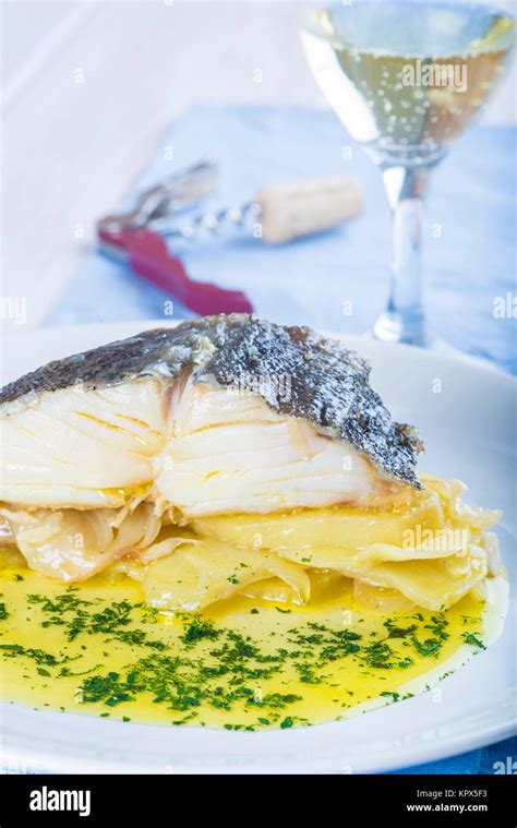 Oven baked cod fish with potatoes Stock Photo - Alamy