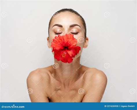 Woman With Closed Eyes Naked Shoulders Red Flower Mouth Decoration Stock Photo Image Of Nature