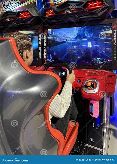 Woman Driving a Racing Game. Girl on a Racing Car Simulator. Concept ...