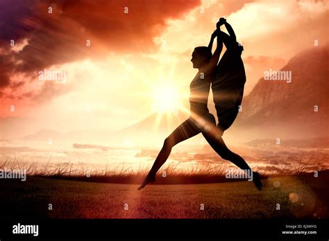 Composite Image Of Gorgeous Fit Blonde Leaping With Scarf Stock Photo Alamy