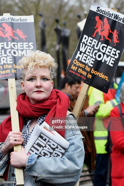 A Protester Seen Holding A Placard That Says Refugees Welcome Here