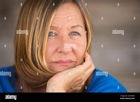 Portrait Attractive Mature Woman In Relaxed Confident Pose Happy Serious Look Blurred