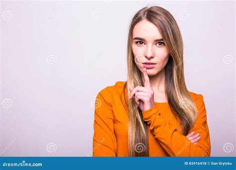 Blonde Girl In Orange T Shirt With Silence Gesture On White Stock Photo Image Of Long Orange