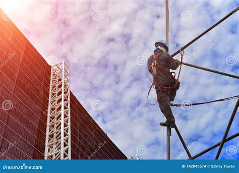 Worker On High Wear Safety Harness On Scaffolding Stock Photo Image